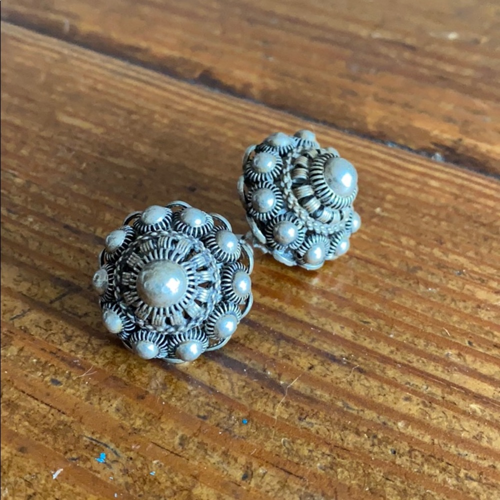Two silver pins